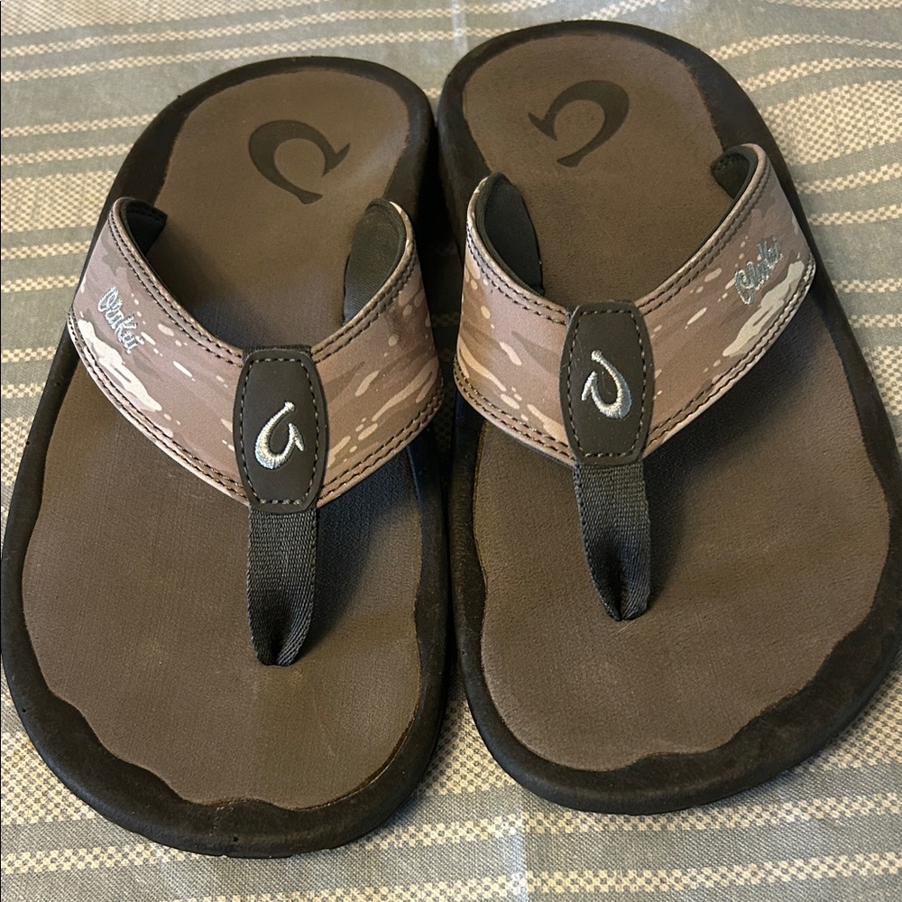 OluKai Tan and Black Flip-Flops